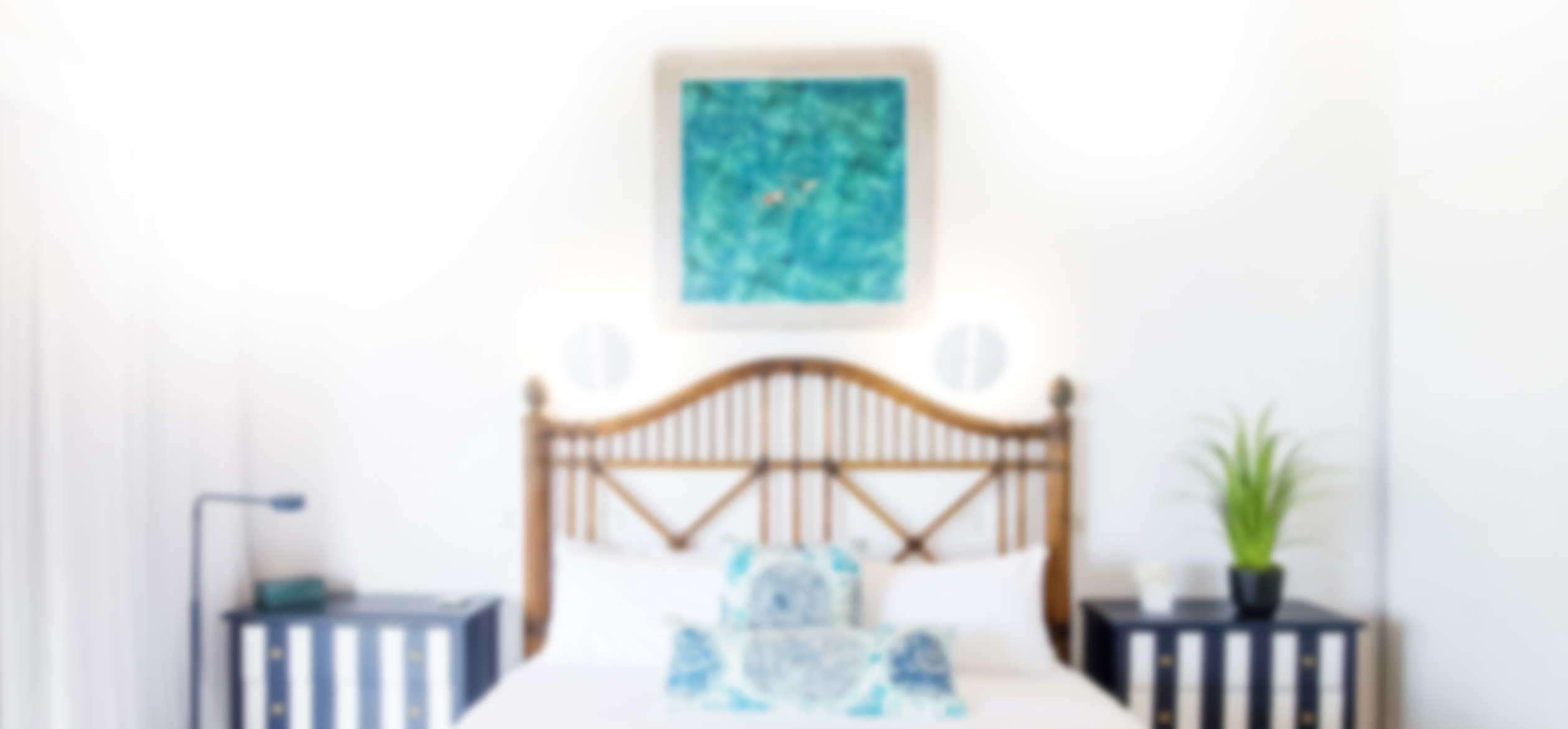 a blurry picture above a bed