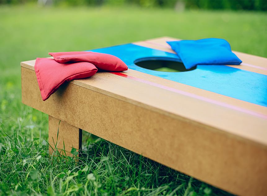 bean bags on a corn hole board