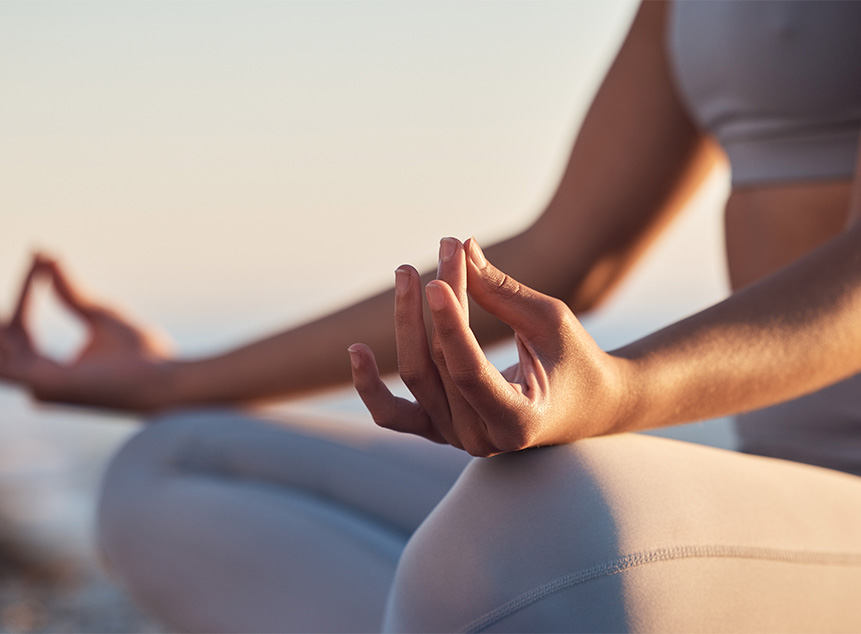 a close-up of hands while meditating