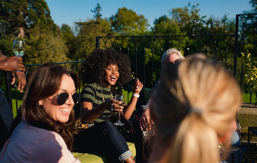 a group of people holding wine glasses