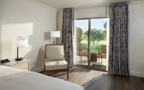 a room with a bed and a chair