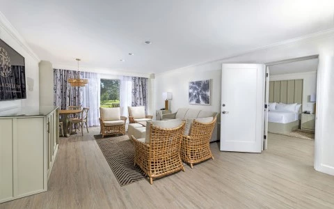 a room with a couch and chairs