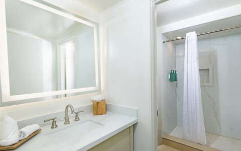 a bathroom with a mirror and sink
