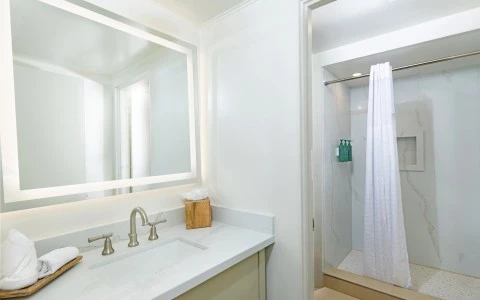 a bathroom with a mirror and sink