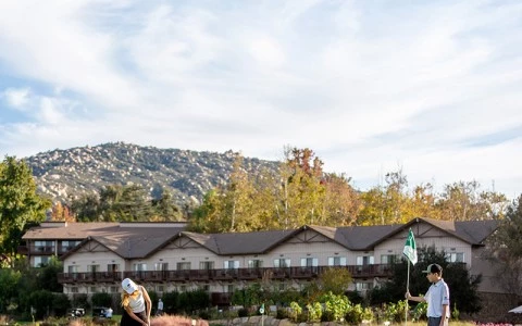 a man and woman playing golf
