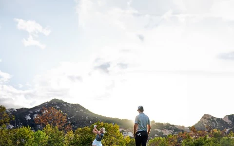 a man and woman playing golf