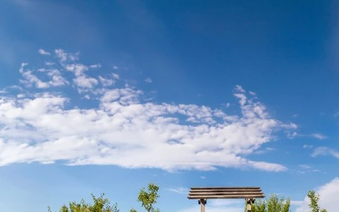 a wooden structure in a field
