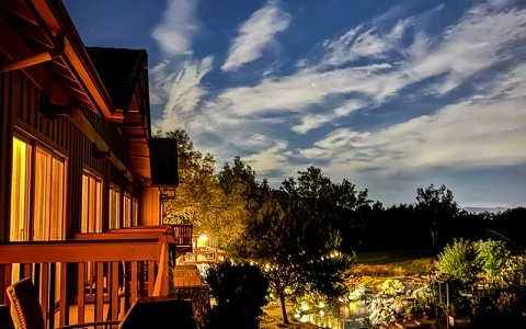 a house with lights on the side of it