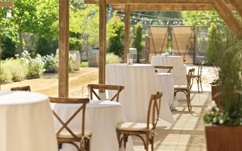 tables and chairs outside on a patio