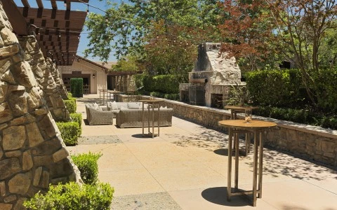 a patio with tables and chairs