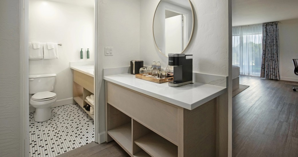 a bathroom with a mirror and a counter top