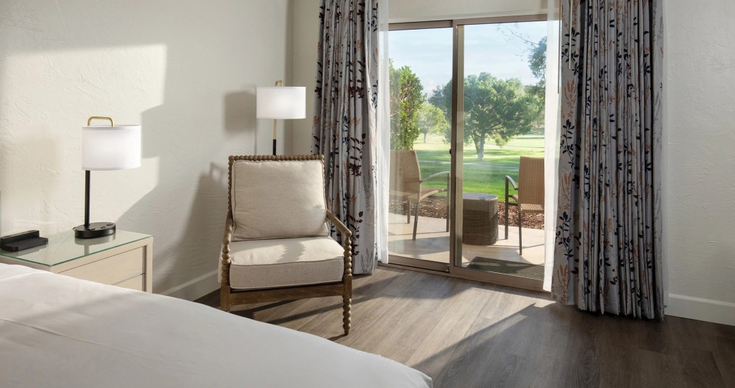 a room with a bed and a chair