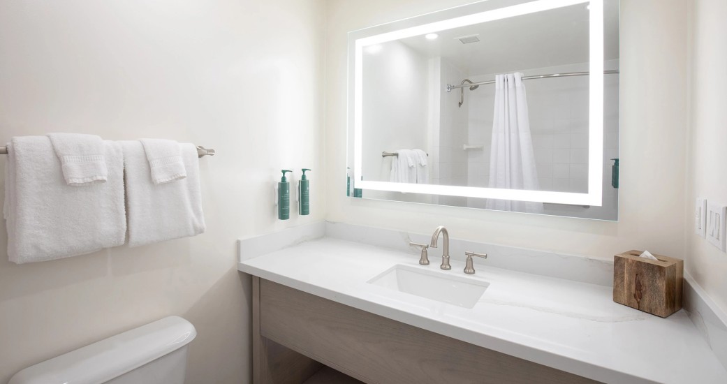a bathroom with a mirror and sink