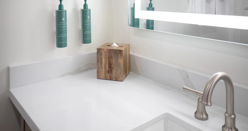 a wooden box of tissues on a counter