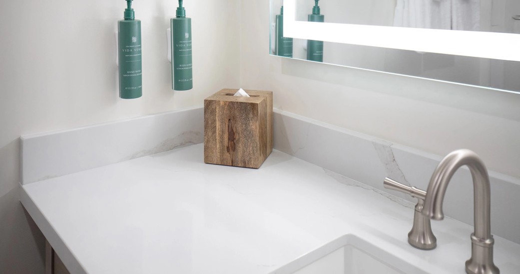 a wooden box of tissues on a counter