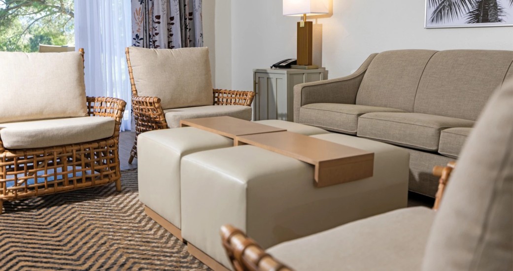 a room with a couch and chairs