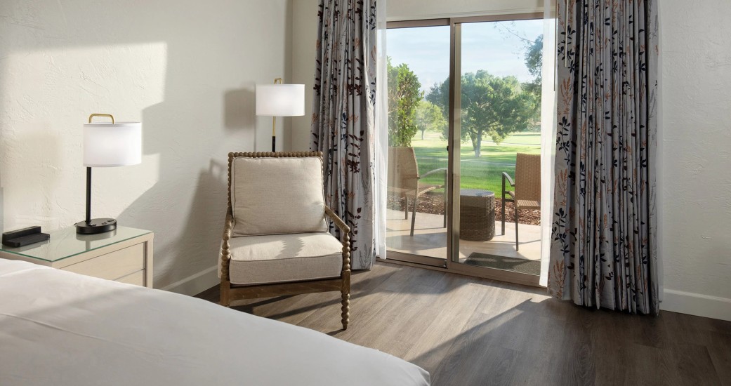 a room with a bed and a chair
