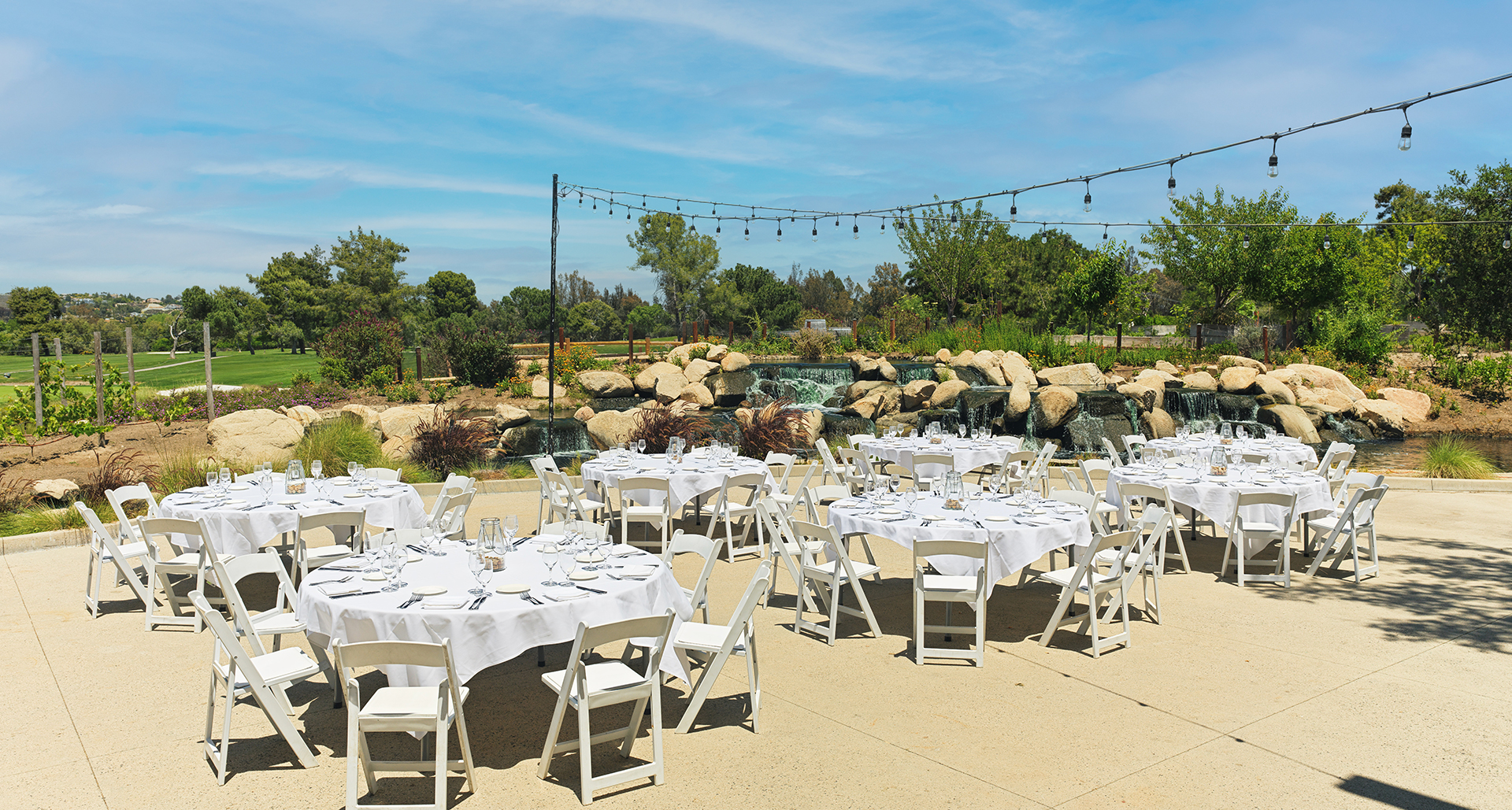 a group of tables set up for a wedding reception