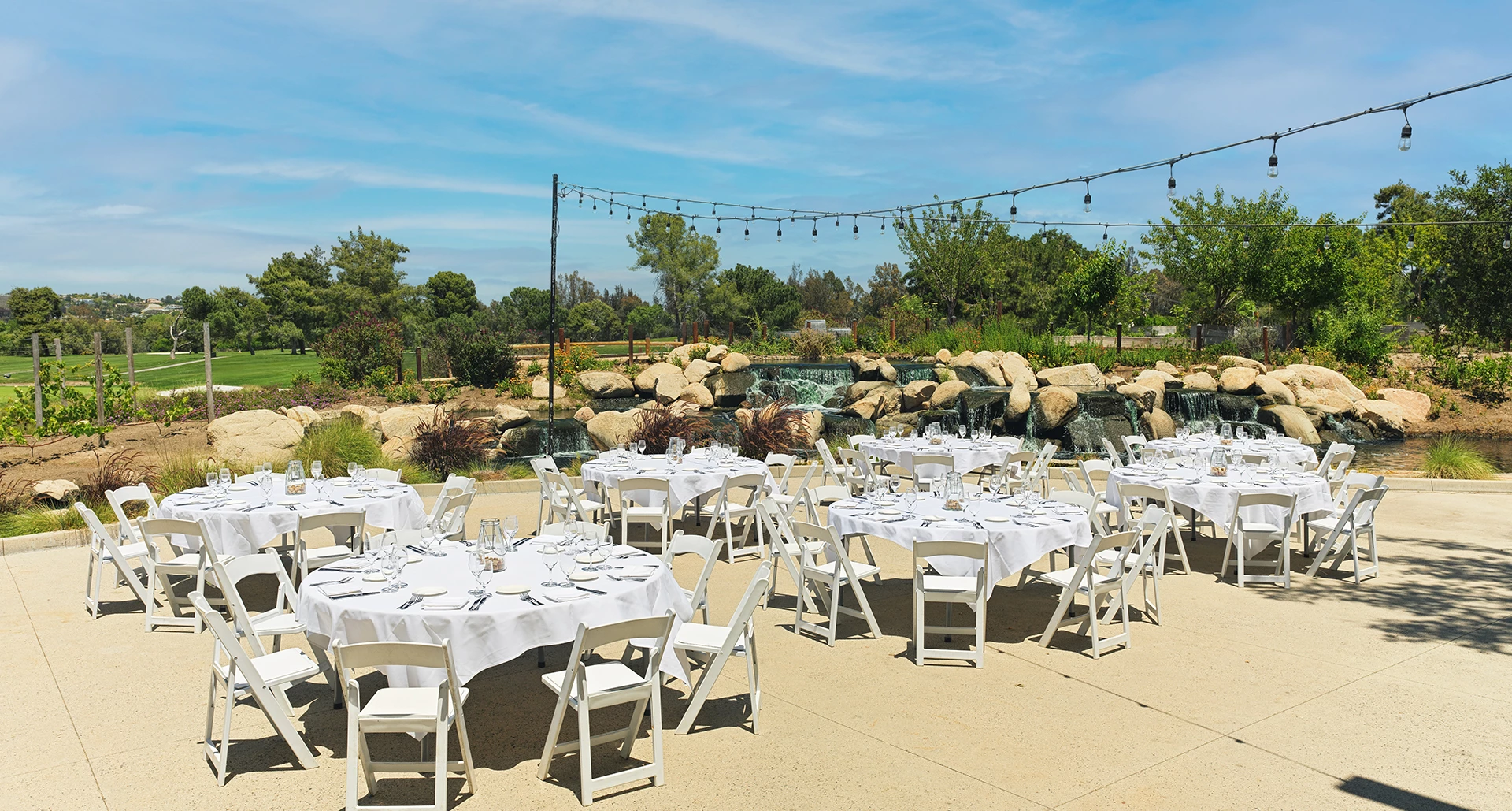a group of tables set up for a wedding reception