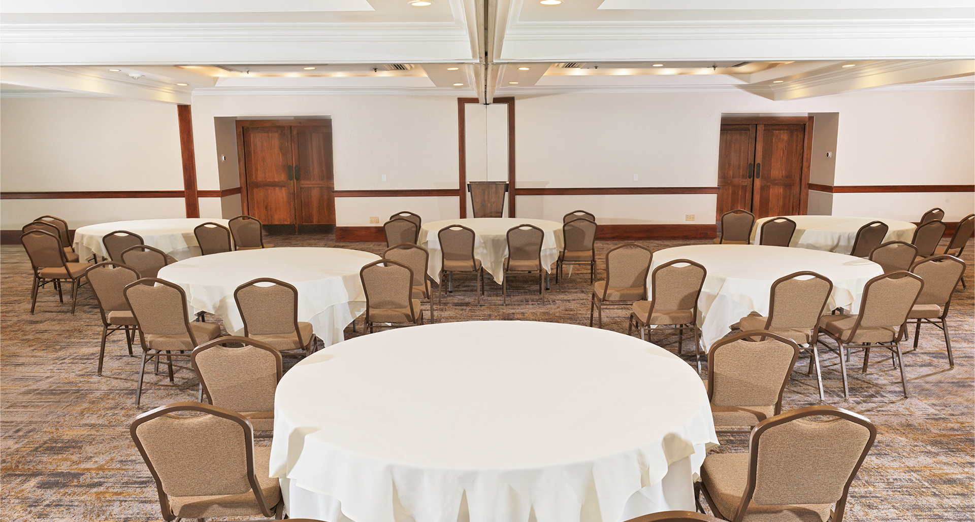 a room with round tables and chairs