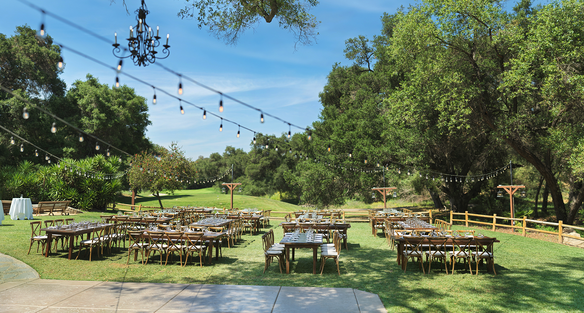 a group of tables and chairs in a field
