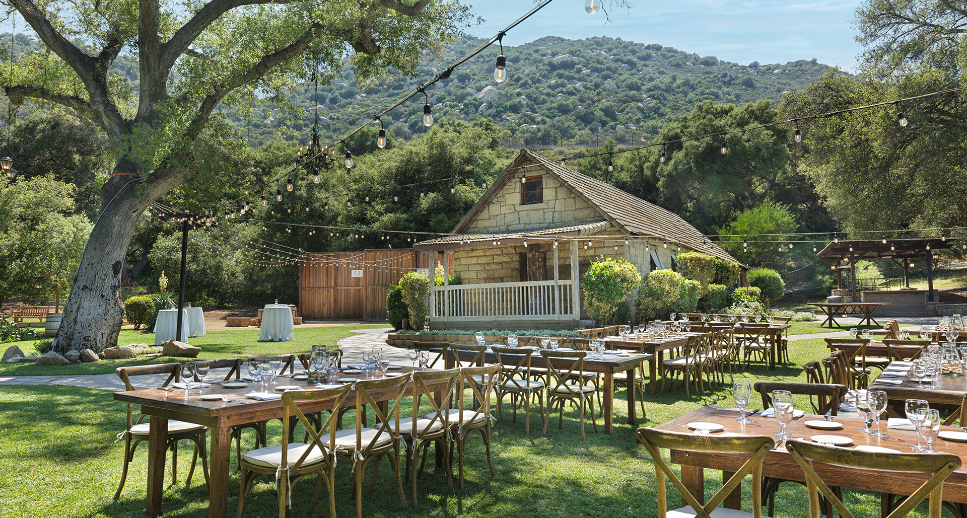 a group of tables and chairs outside