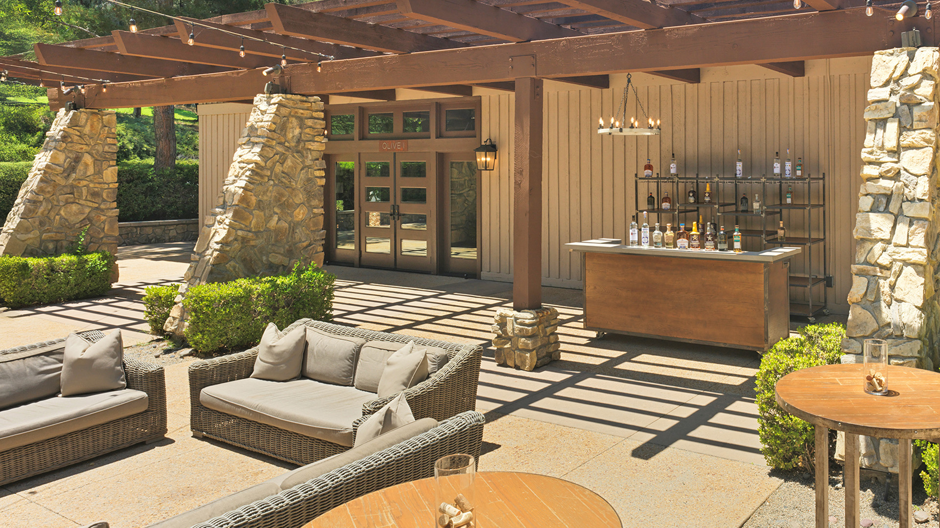 a patio with a bar and a table