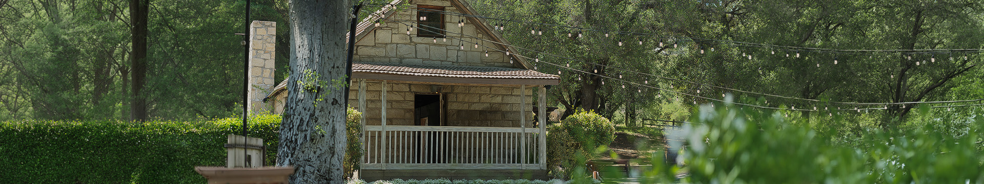 a house with a porch and a string of lights