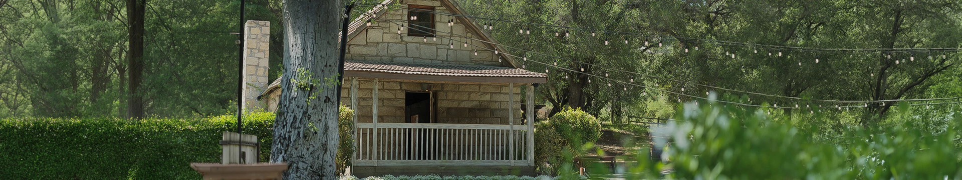 a house with a porch and a string of lights