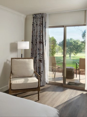 a room with a bed and a chair