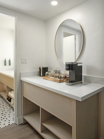 a bathroom with a mirror and a toilet