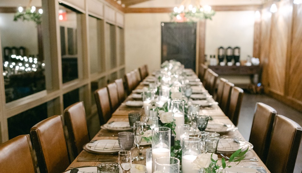 a long table with candles and flowers