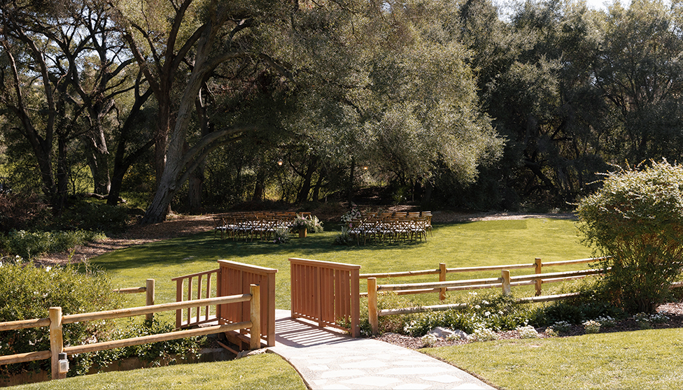 a walkway and chairs in a park