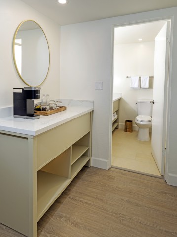 a bathroom with a mirror and a toilet
