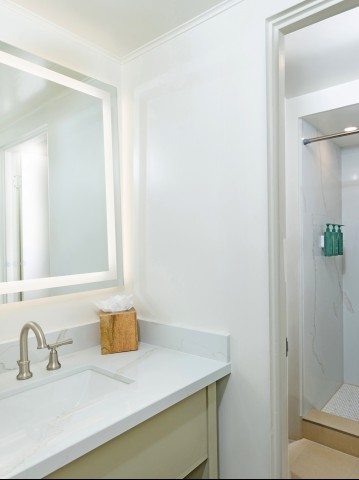 a bathroom with a mirror and sink