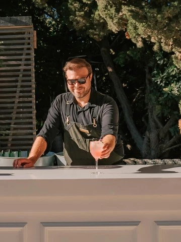 a man standing at a bar