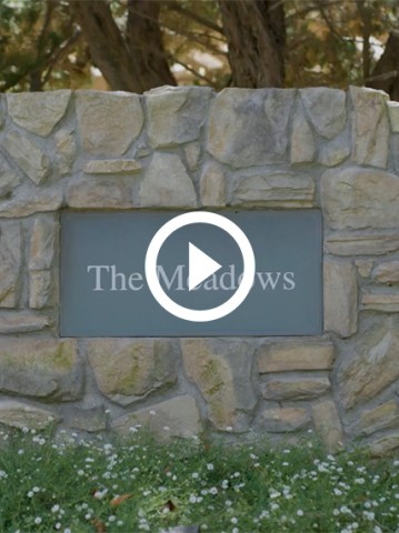 a sign in a stone wall