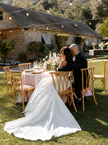 a man and woman sitting at a table