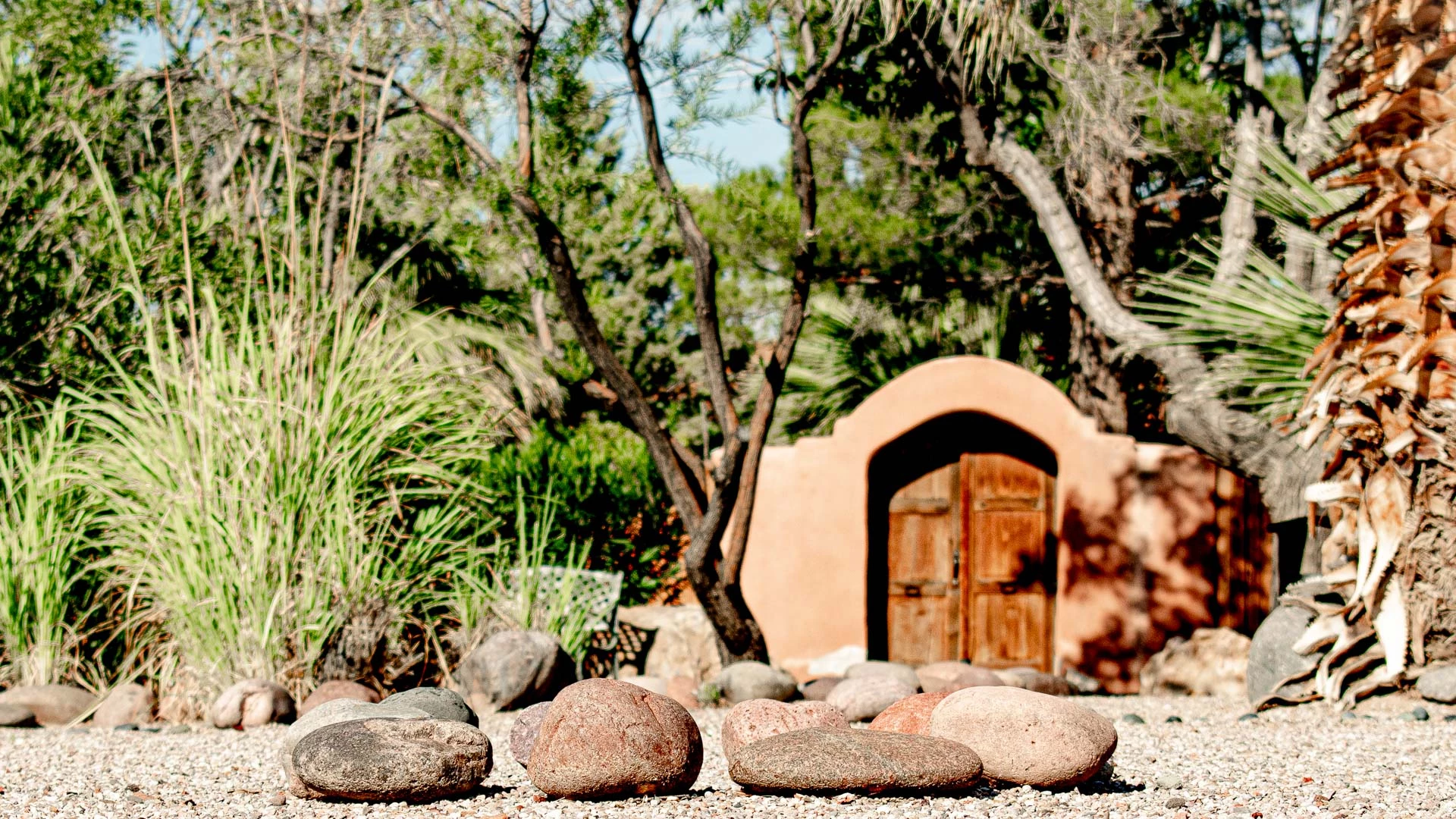 a group of rocks in front of a building