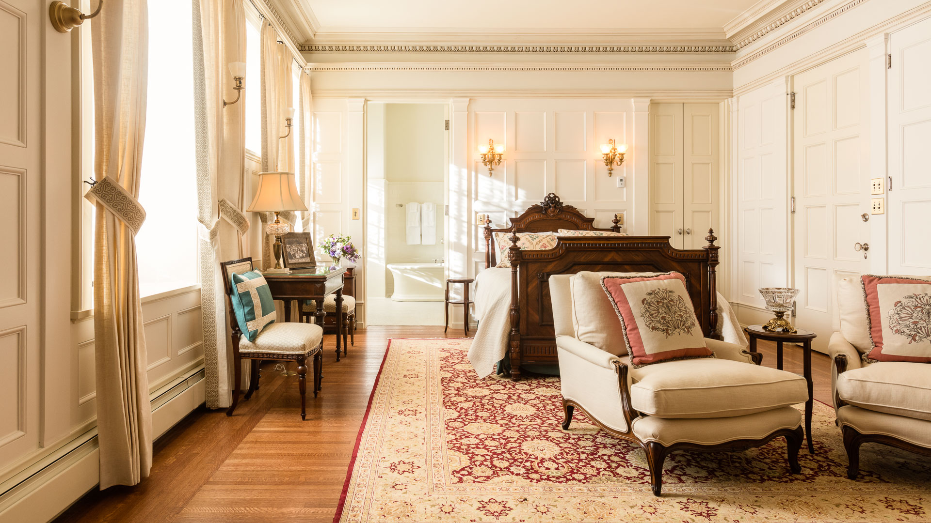 a bedroom with a bed and a chair