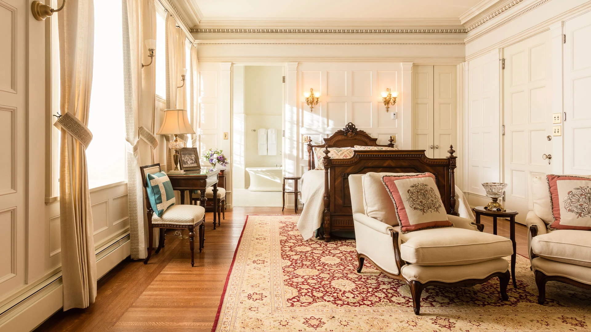 a bedroom with a bed and a chair