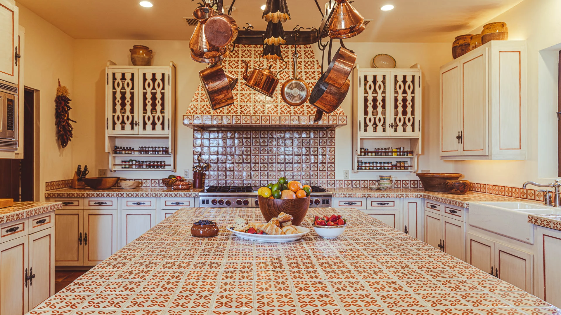 a kitchen with a bowl of fruit on a table
