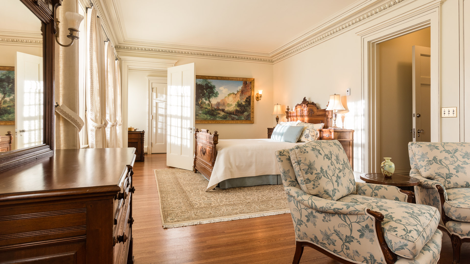a bedroom with a bed and a chair