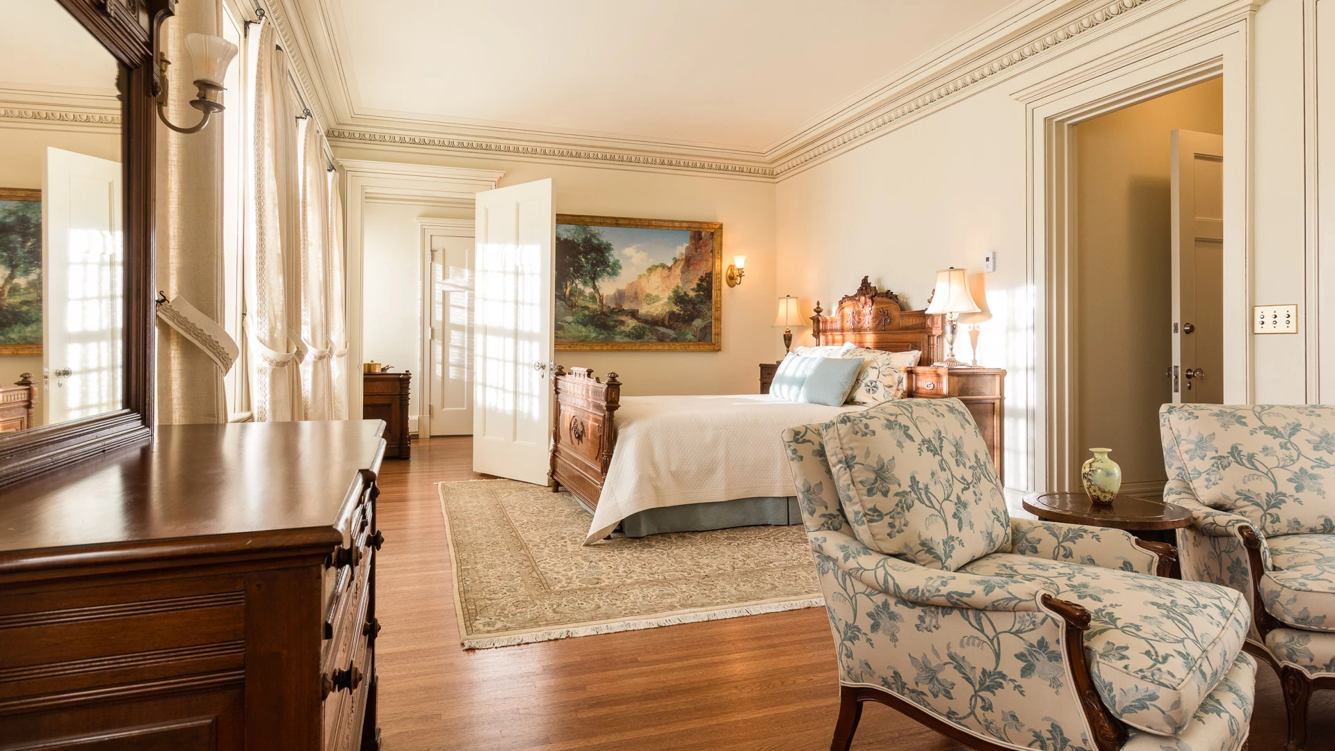 a bedroom with a bed and a chair