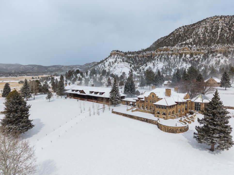 a large building surrounded by snow