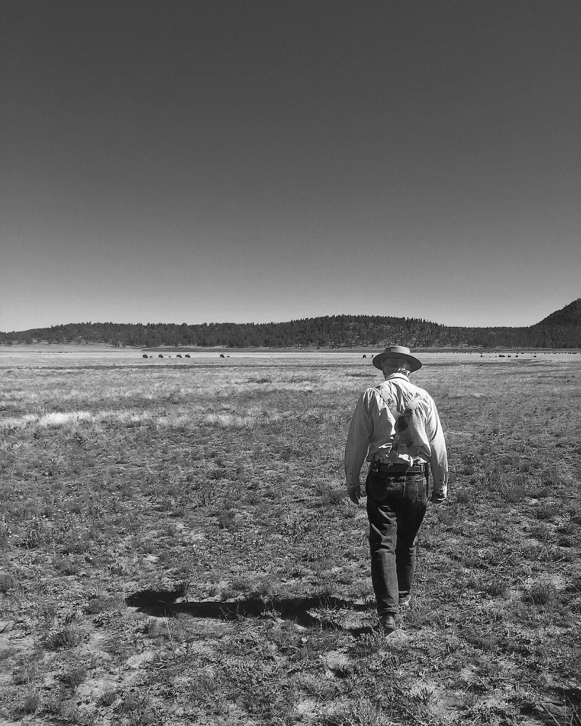 a man walking in a field