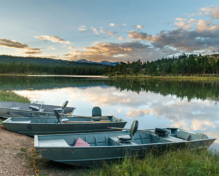 boats on the shore of a lake