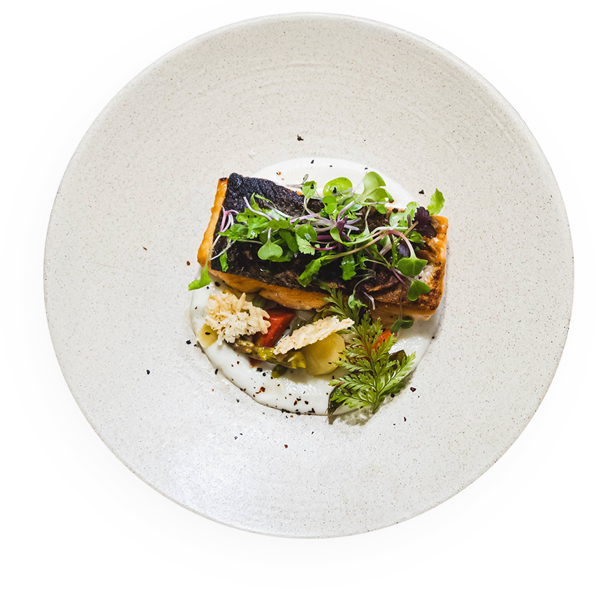 a plate of food on a black background