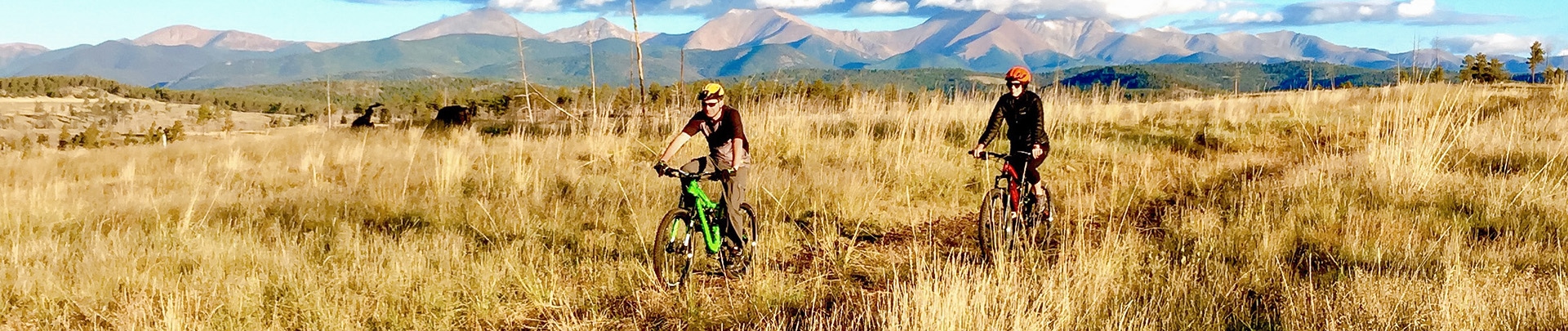 a man riding a bike in a field