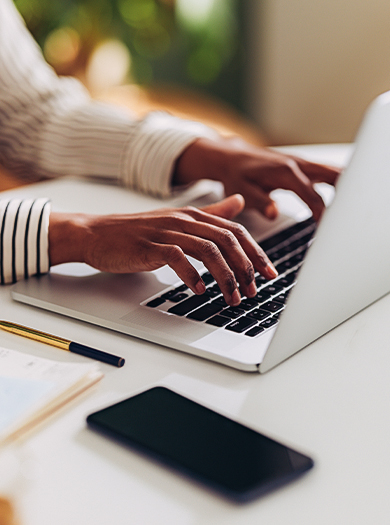 a person typing on a laptop